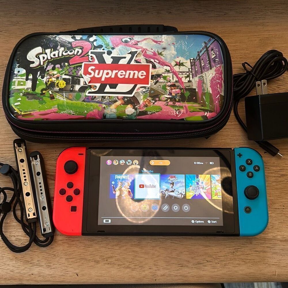 Nintendo switch handheld game with charger and case
